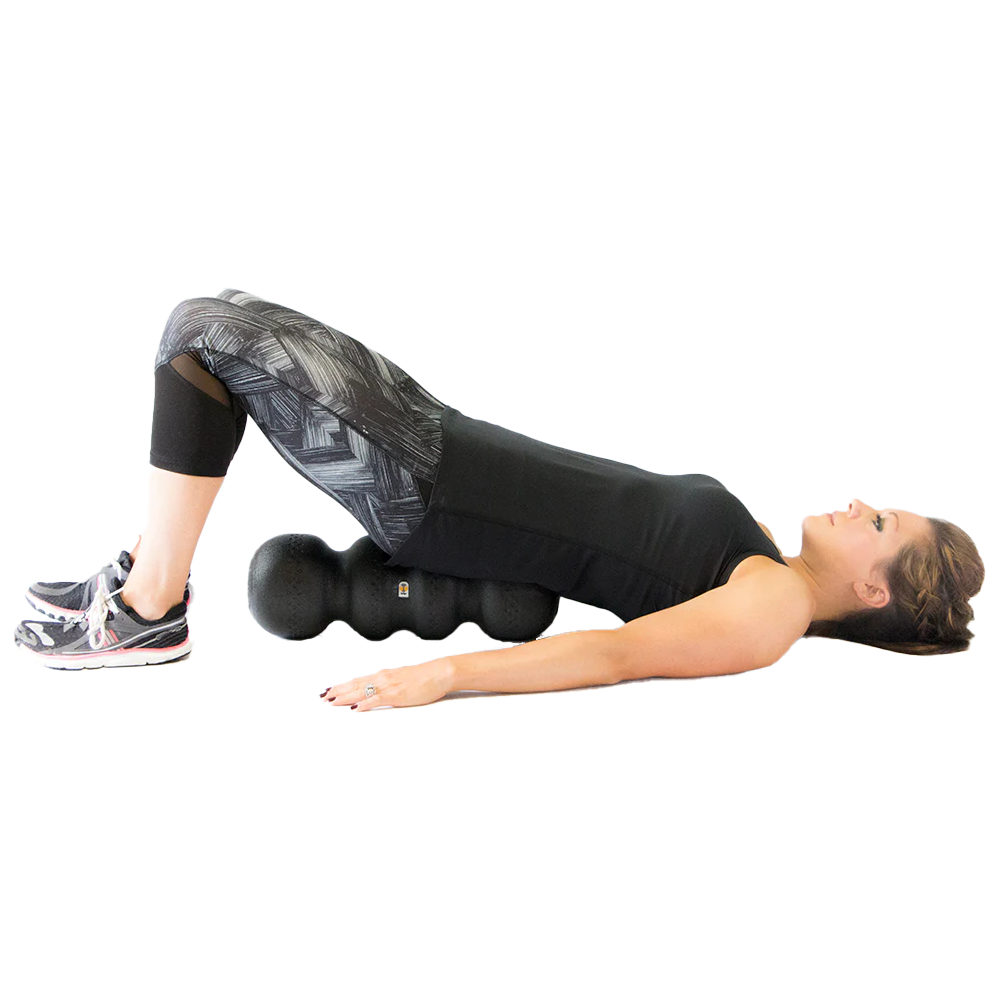 The Rollga is a great prop and works as a bridge to help align your hips. Simple and effective low back pain relief.